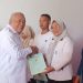 Wabup Tonny Junus Serahkan Sertifikat PTSL di Desa Huidu